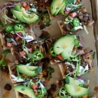 Taco French Bread Pizza topped taco toppings and cut into slices.